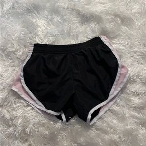 a pair of pink, black, and white shorts